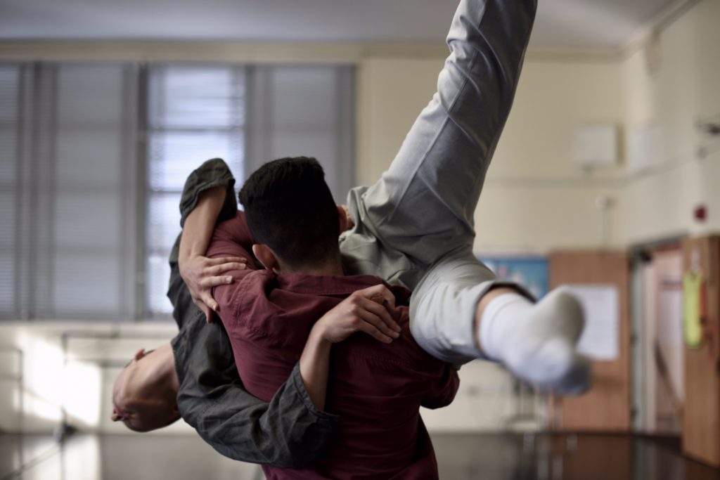 One Training Program student lifts another