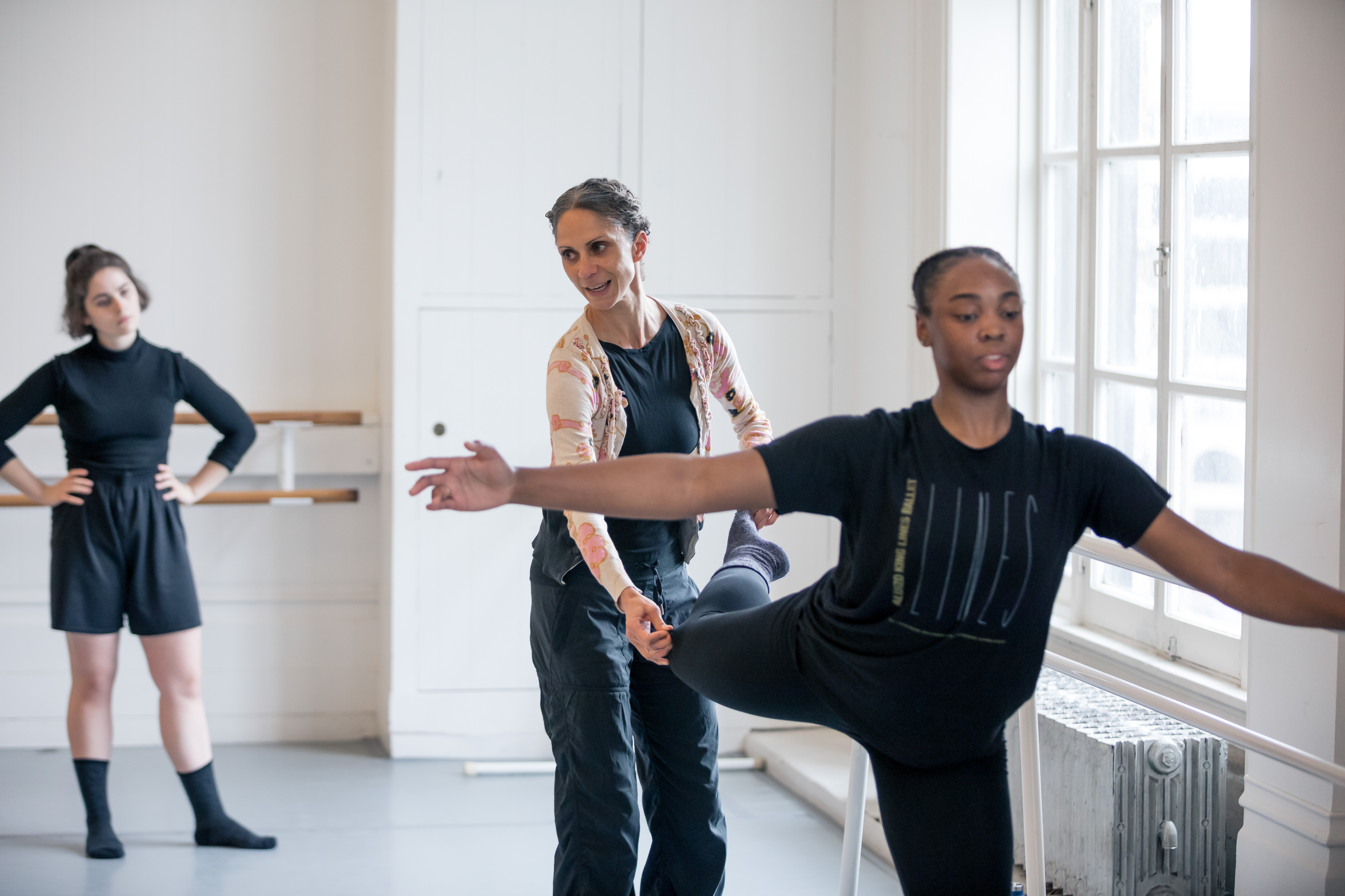 Maurya Kerr correcting a student in a ballet class