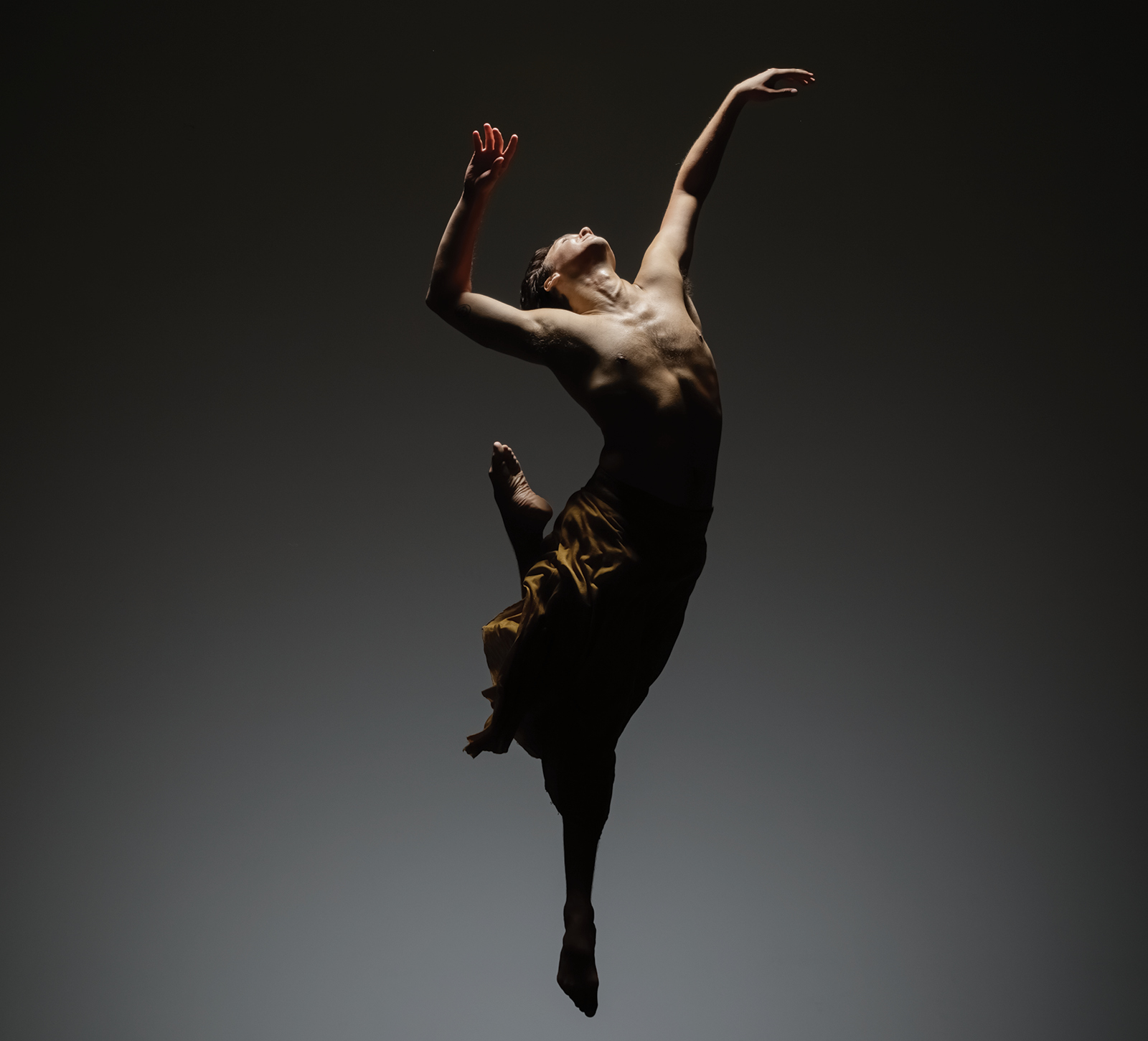 Company Dancer James Gowan jumping upwards