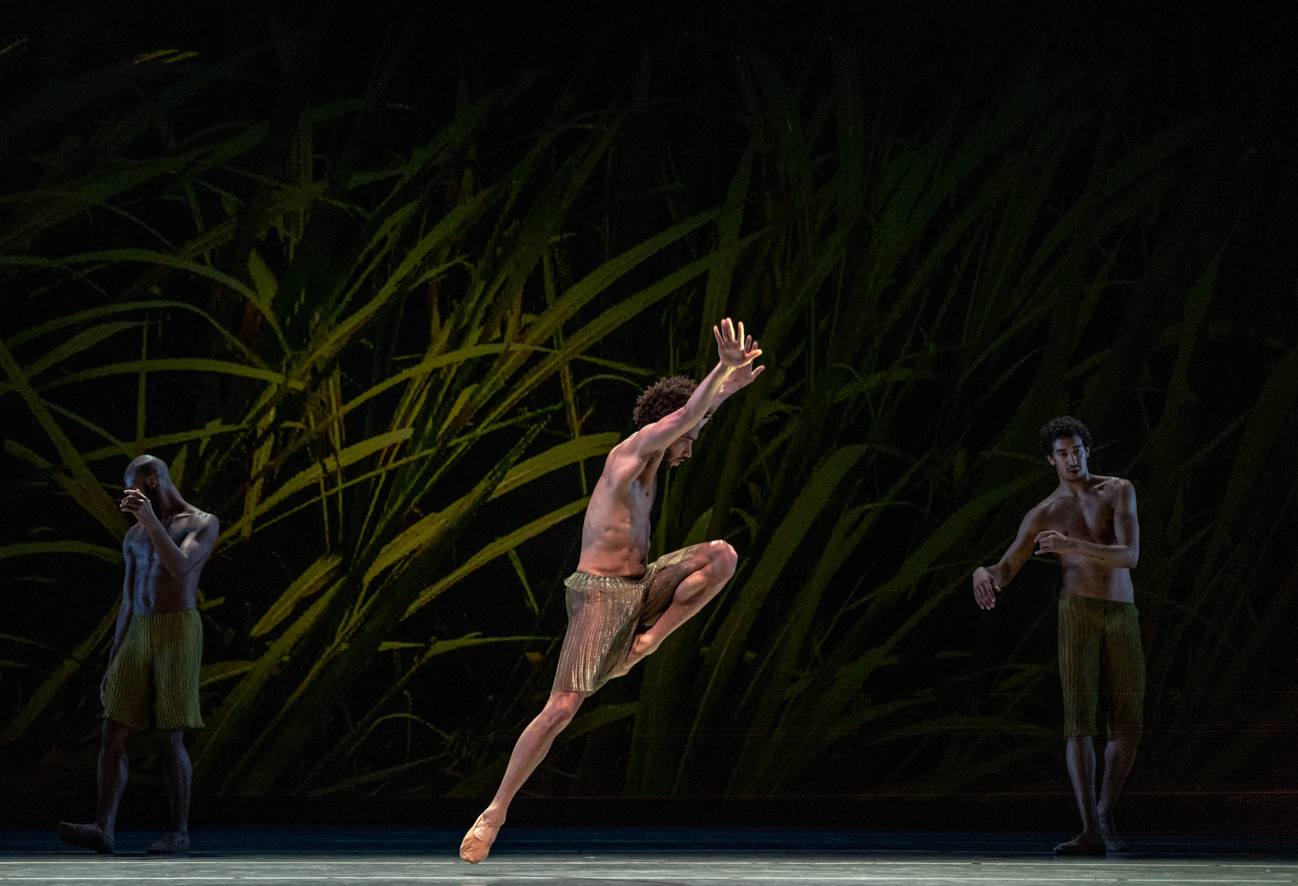LINES Ballet company artists Babatunji Johnson, Shauib Elhassan, and Michael Montgomery performing on stage in Alonzo King's POLE STAR