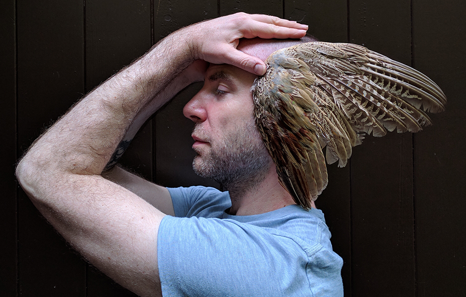 Nol Simonse posing with turkey wings.