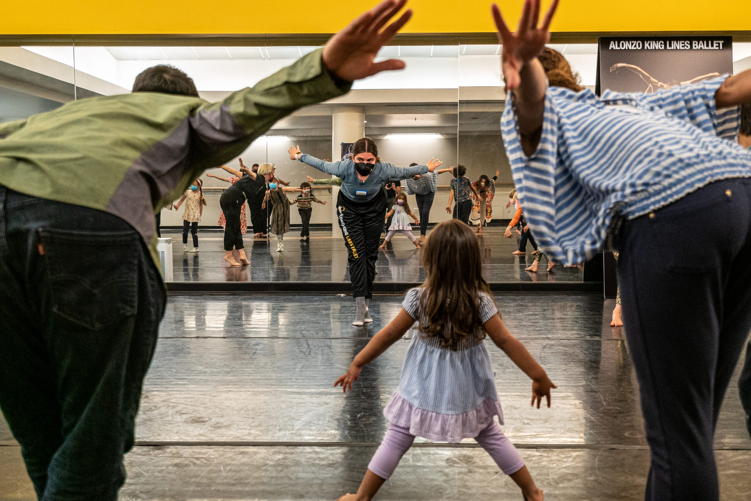 Families dancing with LINES Teaching Artists in the YBCA studio during the Spring 2022 Family Experience