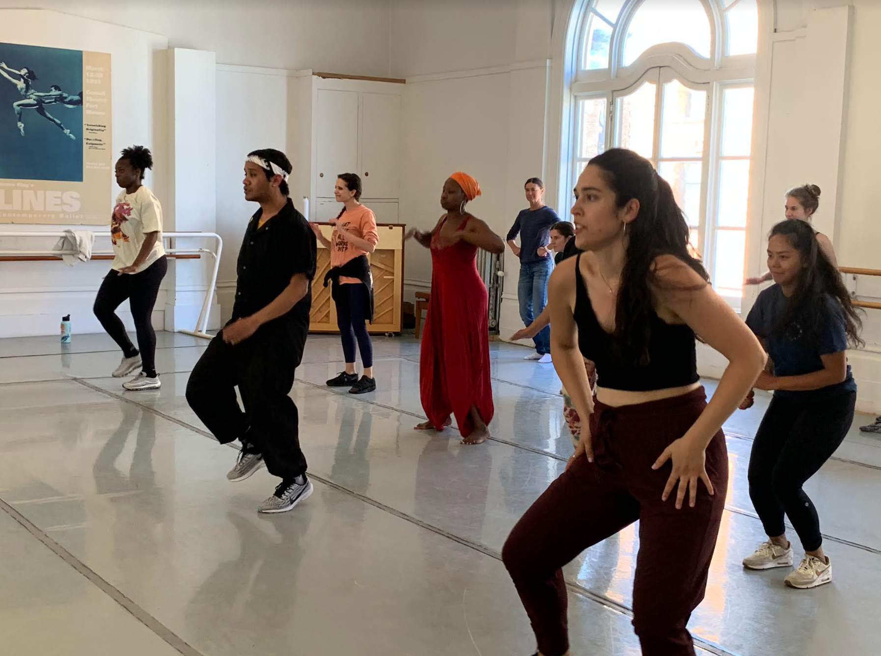 Participants and HeART with LINES faculty dancing and engaging during a Summer Dance Teaching Artist Exchange in a studio at LINES Dance Center