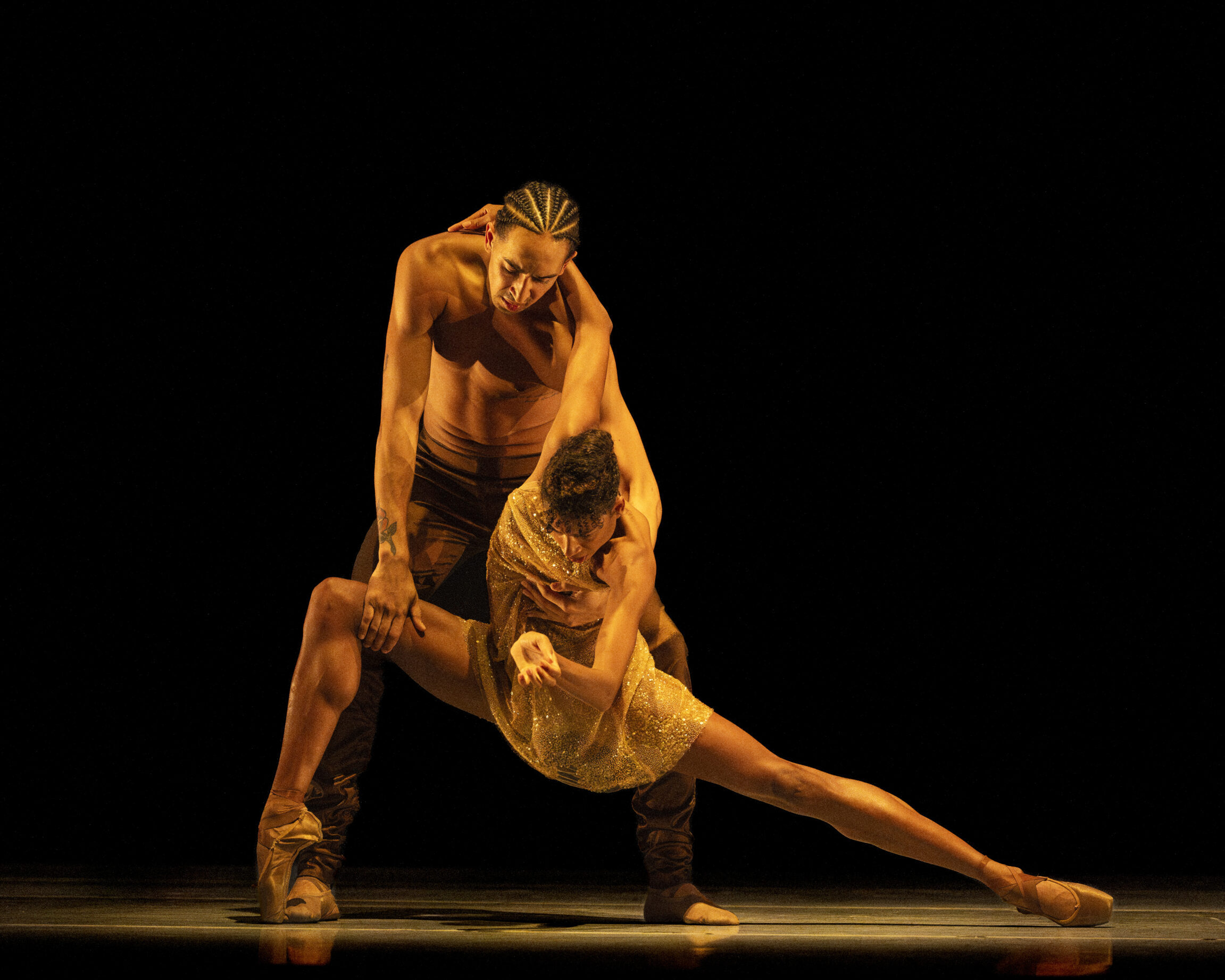 LINES Ballet company dancers Adji Cissoko and Shuaib Elhassan perform choreography by Alonzo King on stage; Adji is en pointe