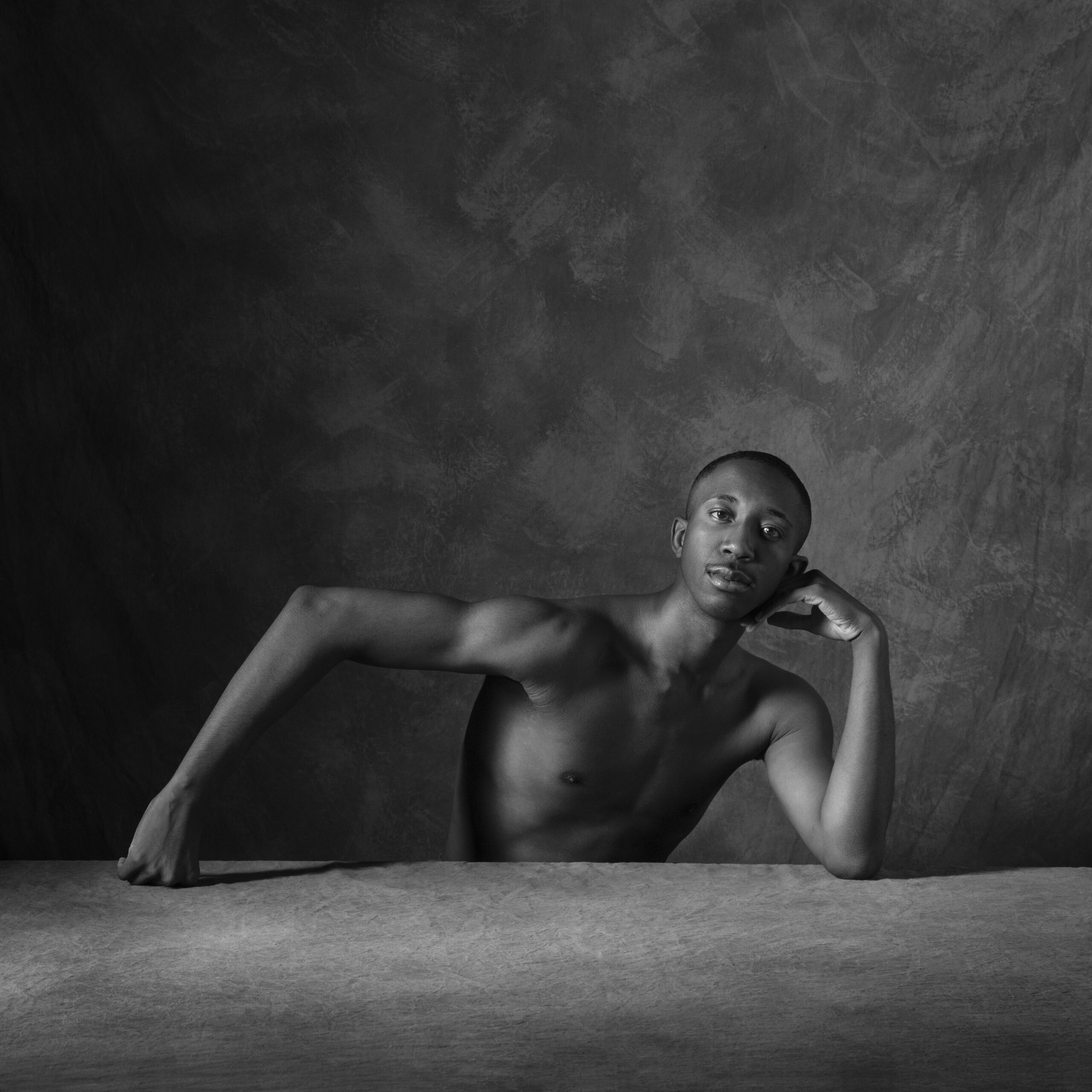 Mikal Gilbert's headshot (in black and white)