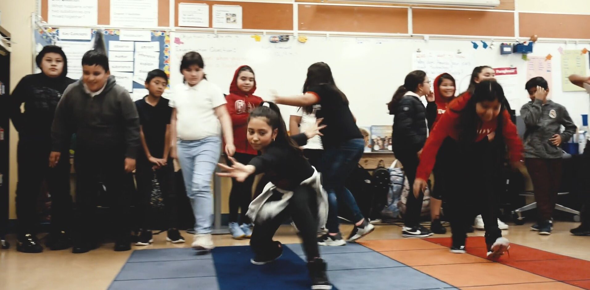Students dancing in a classroom at ER Taylor Elementary