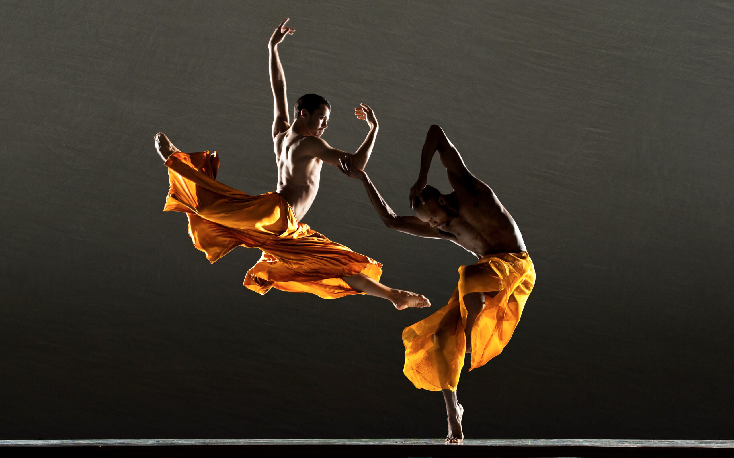 Paulo Arrais and Keelan Whitmore jumping and dancing together