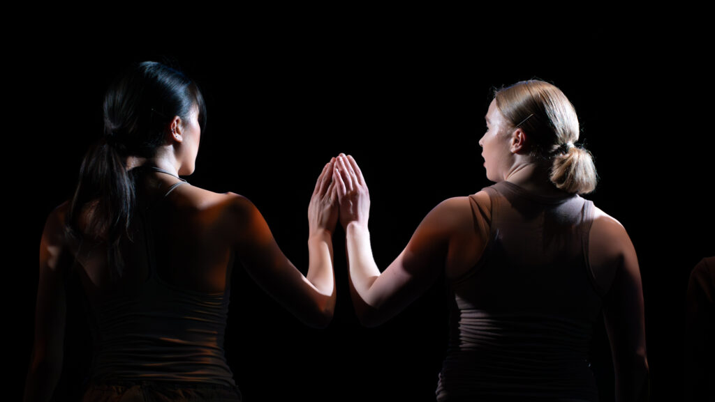 Two LINES Ballet Training Program students performing a work on stage choreographed by Chuck Wilt