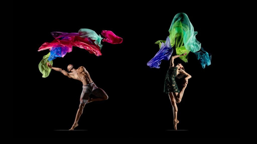 LINES Ballet dancers Josh Francique and Ilaria Guerra dancing as large, multi-colored sheer sheets of fabric waft above them