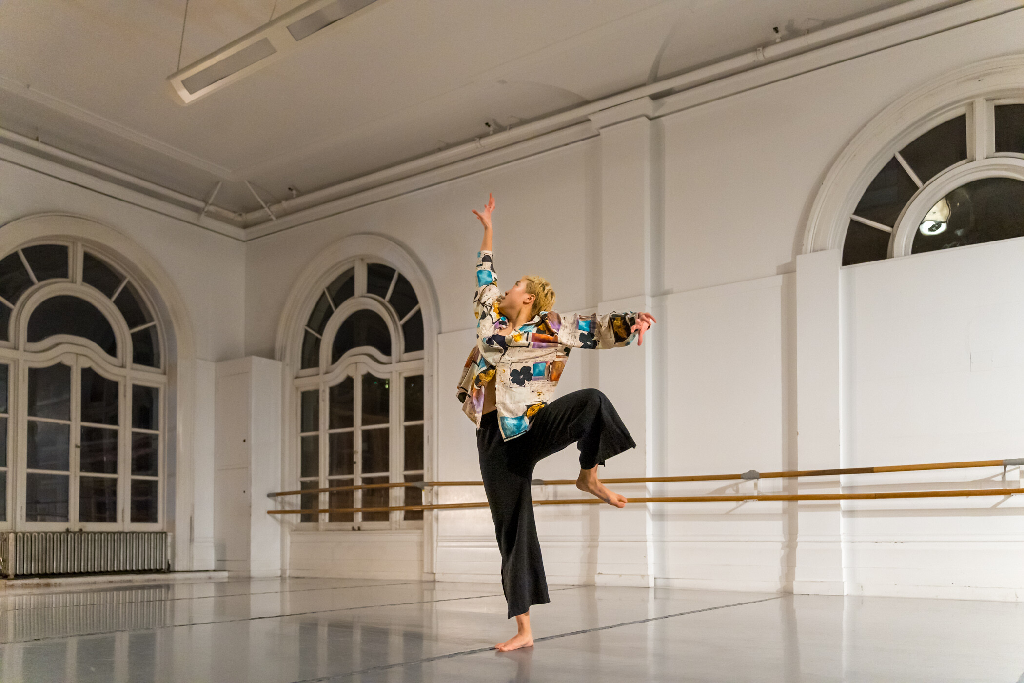 Former LINES Ballet Training Program artist dancing in a studio at LINES Dance Center