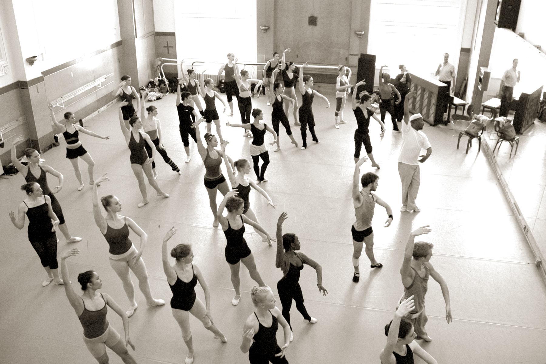 Black and white image of dancers in the studio taken from above