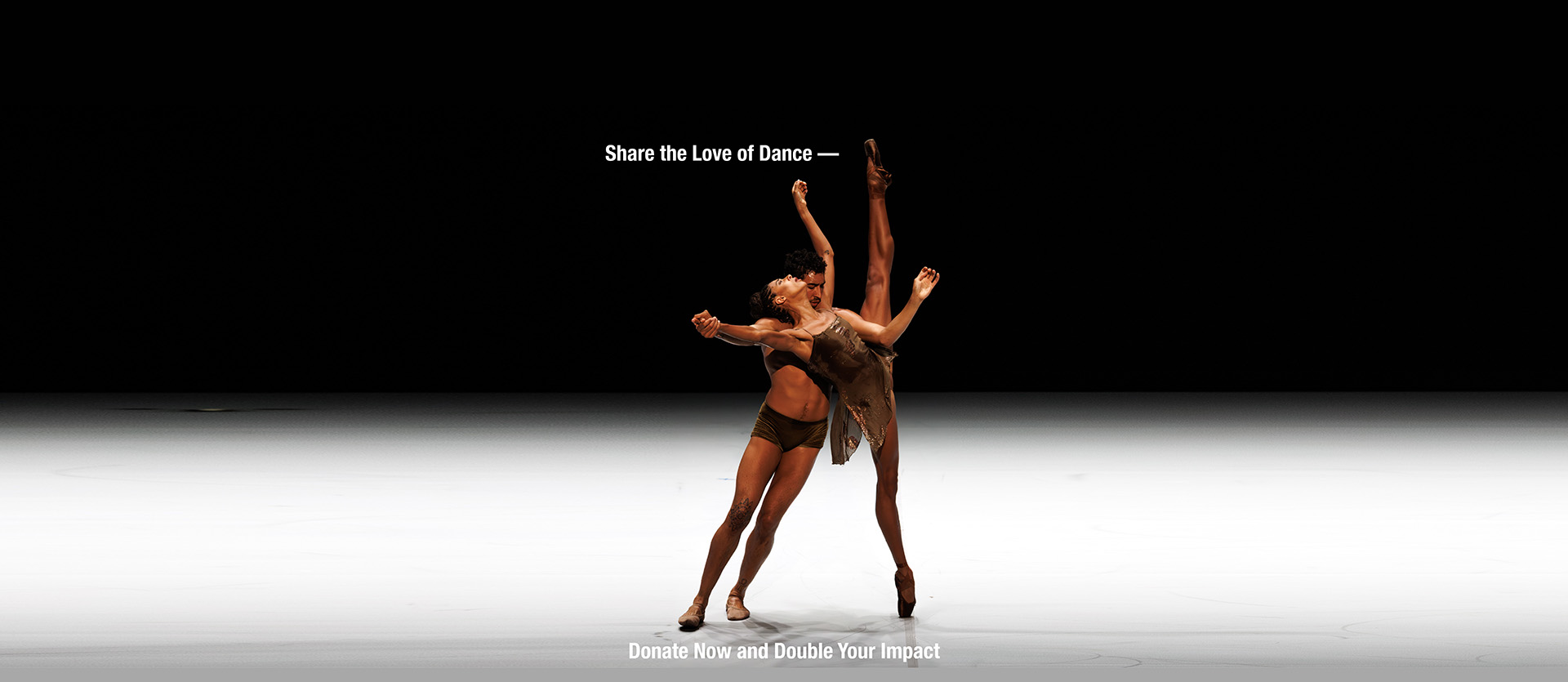Company dancers Adji Cissoko and Shuaib Elhassan lean on one another in a pas de deux