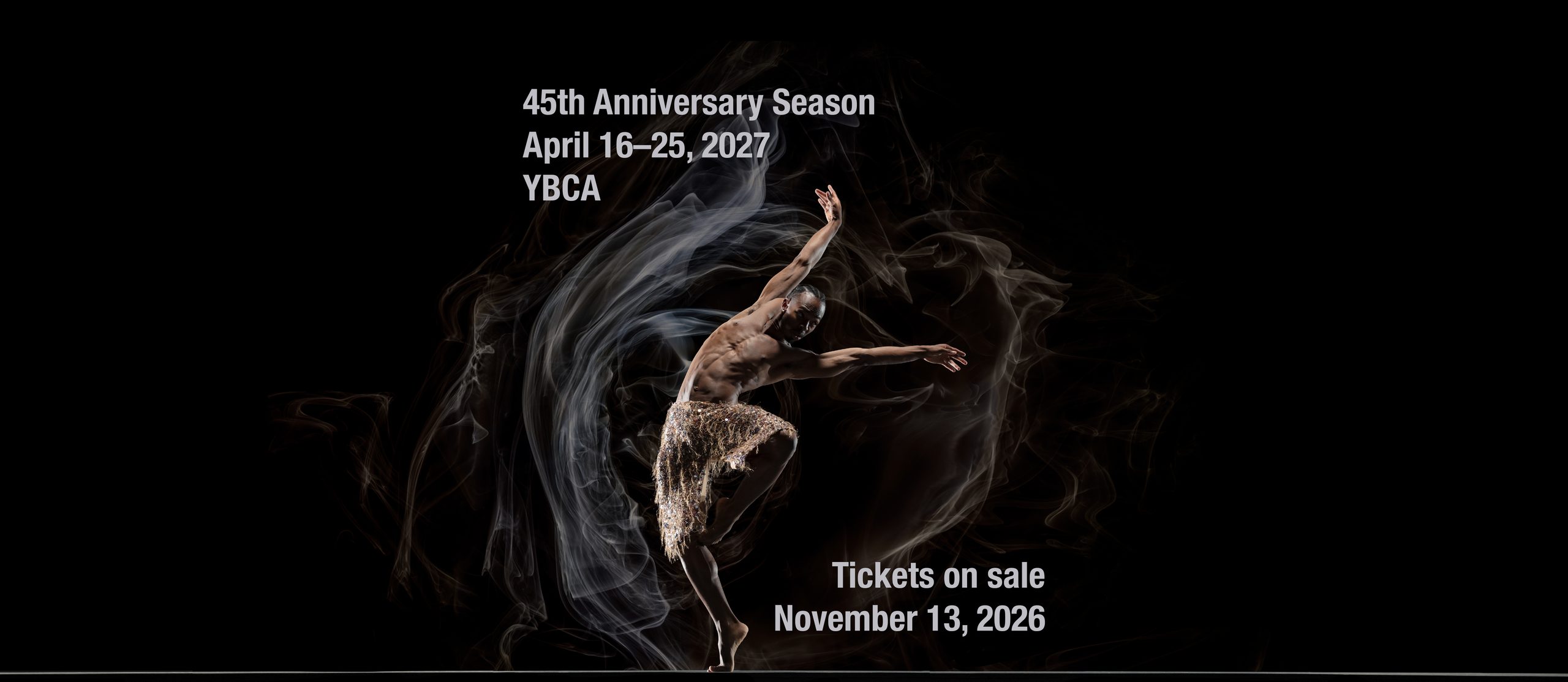 Company Dancer Joshua Francique balances off center on one foot, arms reaching strong and high. Copy reads: "45th Anniversary Season; April 16–25, 2027; YBCA; Tickets on Sale November 13, 2026"
